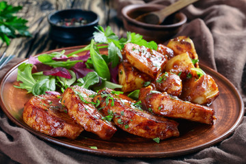 grilled sticky glazed Pork cutlets on a plate