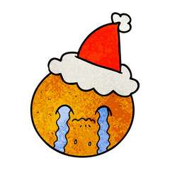 textured cartoon of a orange wearing santa hat