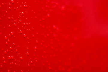 wet red perspective area soft focus foreshortening with drops on surface after rain, simple...