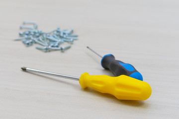 Tools worker, screwdriver, nail, screw on a white background