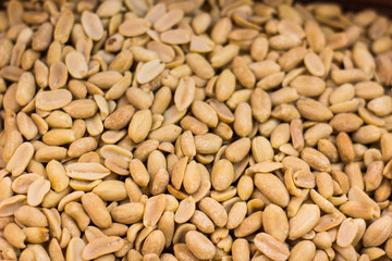 peanut fried nuts background texture surface in market counter, food wallpaper pattern concept