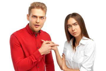 couple arguing and swearing with the indignant persons showing each other the index finger.