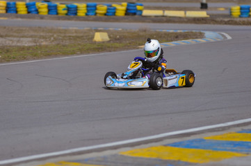 Young go cart racer on circuit
