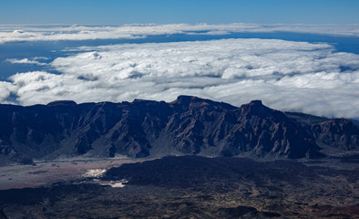 Aerial view of mountain range and clouds