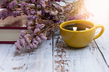 Yellow cup of hot coffee.