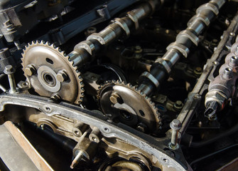 Close up old camshafts of disassembled engine under repair.