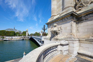 Fototapeta premium Alexandre III bridge with empty balcony in a sunny summer day, blue sky in Paris, France.