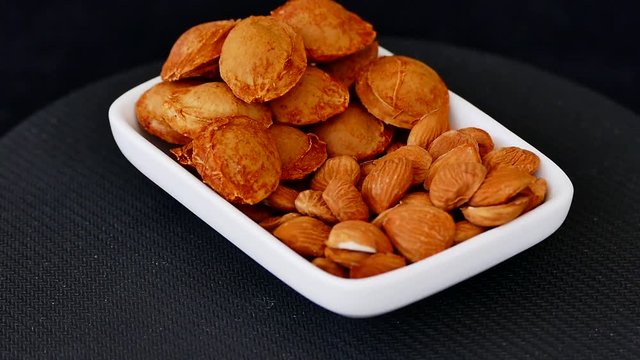 Apricot kernels in 360 degree rotating stand,
