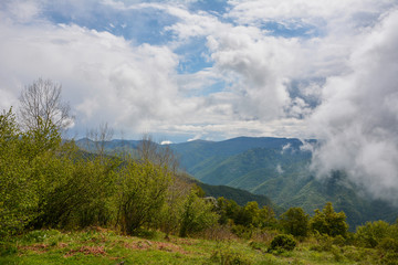 Obraz premium Spring landscape in Rhodope mountain, Bulgaria rainy puffy clouds 