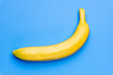 Minimal concept Banana fruit on colored blue pastel background. Creative concept.