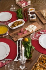 breakfast table with olives, cheese, jam  and turkish base
