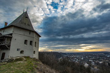Tower of a medieval castle at sunset