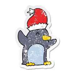 distressed sticker of a cute cartoon christmas penguin