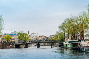 Obraz premium Amsterdam, Netherlands September 5, 2017: canals and rivers. City landscape. Tourist place. Sights.