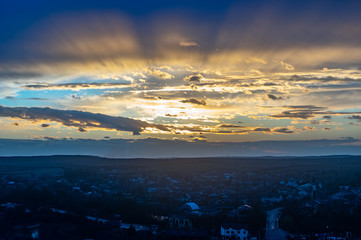 Clouds in the sunset sky over the village