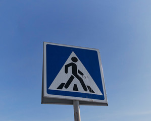 Pedestrian road sign against the sky. Road sign.