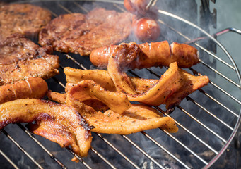 Unhealthy but tasty grilled sausages and meat