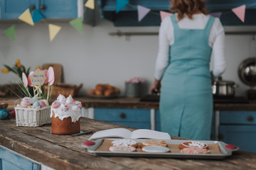 Easter bakery with copybook on kitchen table
