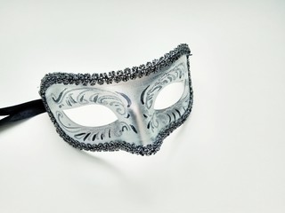 beautiful carnival silver mask with patterns on white background