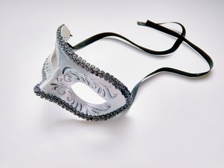 beautiful carnival silver mask with patterns on white background