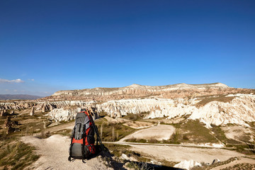 Fototapeta premium Red backpacks are high in the mountains in the summer hike.