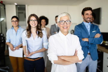 Group of successful business people in office