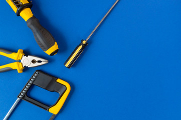 A set of tools for repair isolated on a blue background.