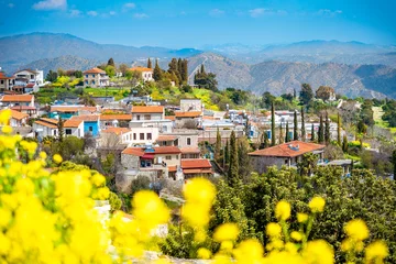 Wall murals Cyprus Amazing view of famous landmark tourist destination valley Pano Lefkara village, Larnaca, Cyprus known by ceramic tiled house roofs and Greek orthodox church