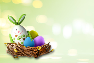 Easter theme with ears of bunny above the colorful eggs. Funny holidays decoration