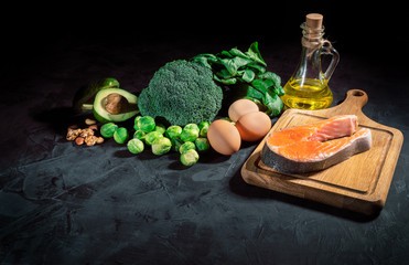 Food with natural vitamin Omega 3 and unsaturated fats. Concept of healthy vegan food on dark background