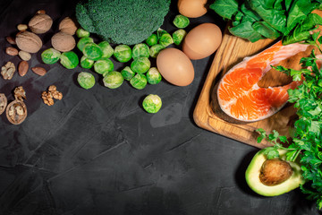 Food with natural vitamin Omega 3 and unsaturated fats. Concept of healthy vegan food on dark background. Top view with copy space