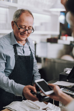 Shop Owner Using NFC Technology To Accept Payment From Customer