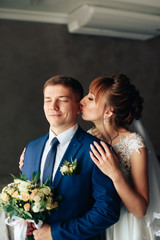 newlyweds in the apartment, a beautiful bride and groom in the rich interior 1