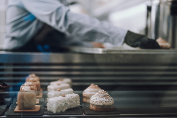 Delicious cakes waiting for customers in bakery shop