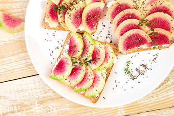 Healthy breakfast toasts from sliced watermelon radish