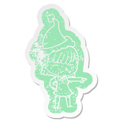 cartoon distressed sticker of a woman wearing santa hat