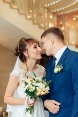 newlyweds in the apartment, a beautiful bride and groom in the rich interior 1