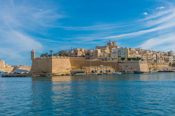 Fototapeta na wymiar View from the boat on the picturesque gulf and Three cities, Malta
