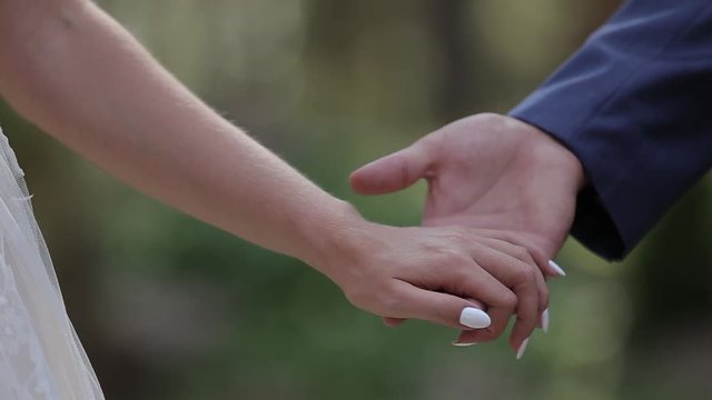 Marry Me Today And Everyday. Newlywed Couple Holding Hands, Shot In Slow Motion.