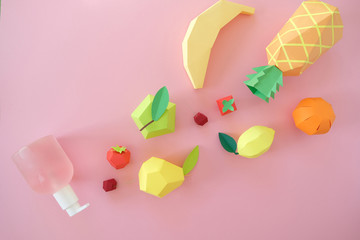 exotic fruits made of paper on pink background