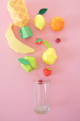 exotic fruits made of paper on pink background
