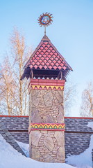 Beautiful chimney on roof with  elegant weather vane