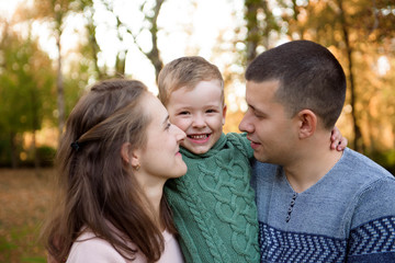 Fototapeta premium Happy family resting in beautiful autumn park