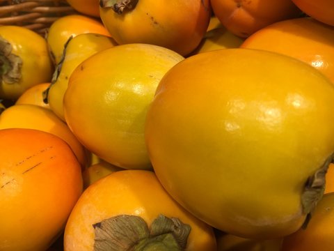 Heap of fresh persimmons