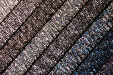 A set of samples of fabric furniture decoration lines of textile textures. Multicolored stripes upholstery. Mode and tone for a luxurious interior style. Abstract background