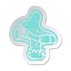 distressed old sticker of a single mushroom