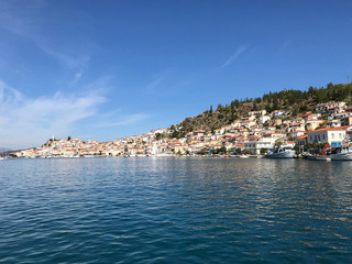 view from the yacht to the island with the traditional architecture in the Greek style. entry into...