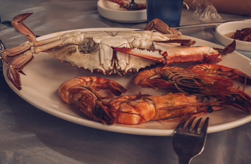 boilled shrimps and crab on plate