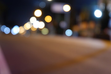 Artistic style dark defocused and blured lights of night in the city