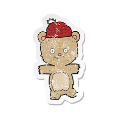 retro distressed sticker of a cartoon bear in hat